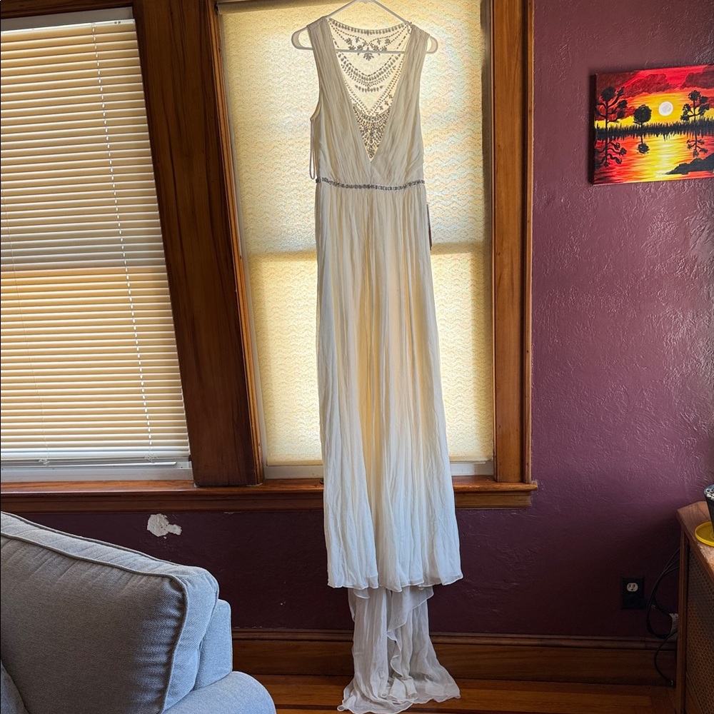 Elegant White Gown with Beaded Bodice